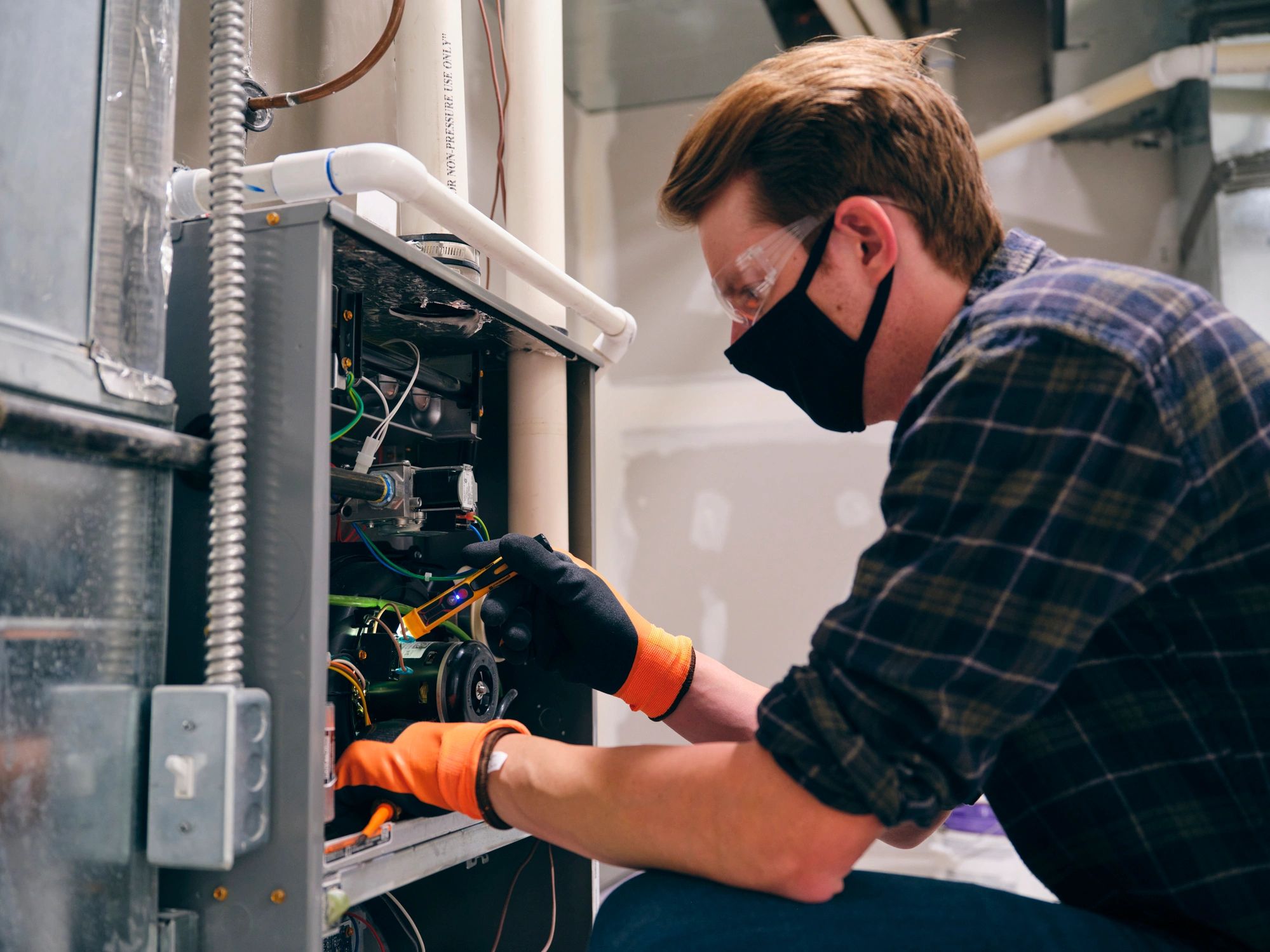 HVAC technician performing an indoor system inspection