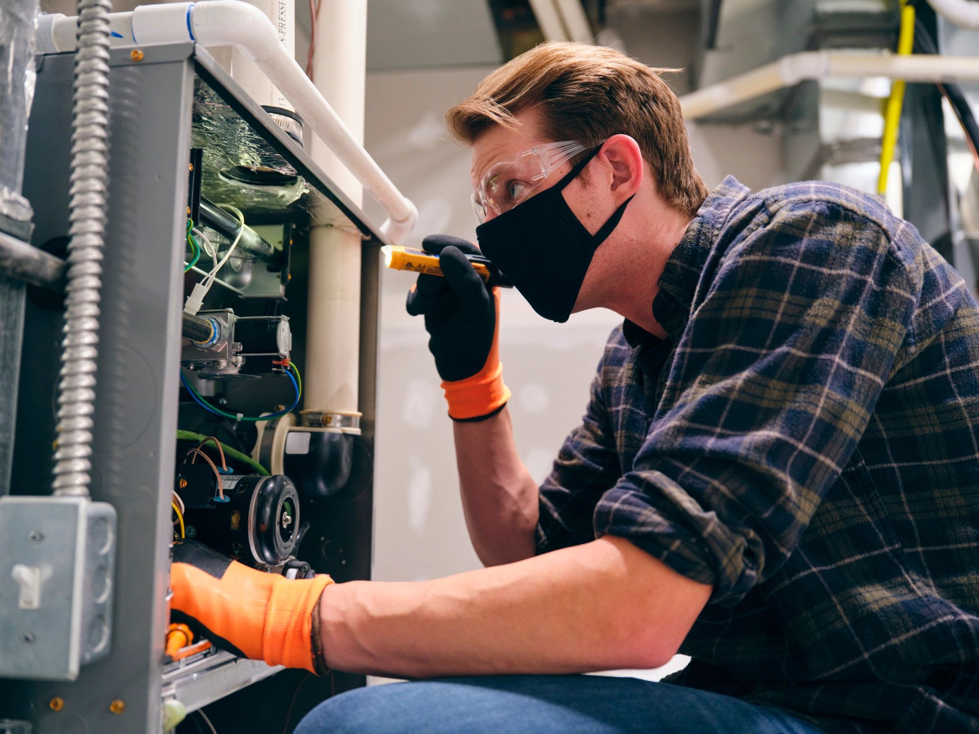 HVAC technician working inside a home during an installation
