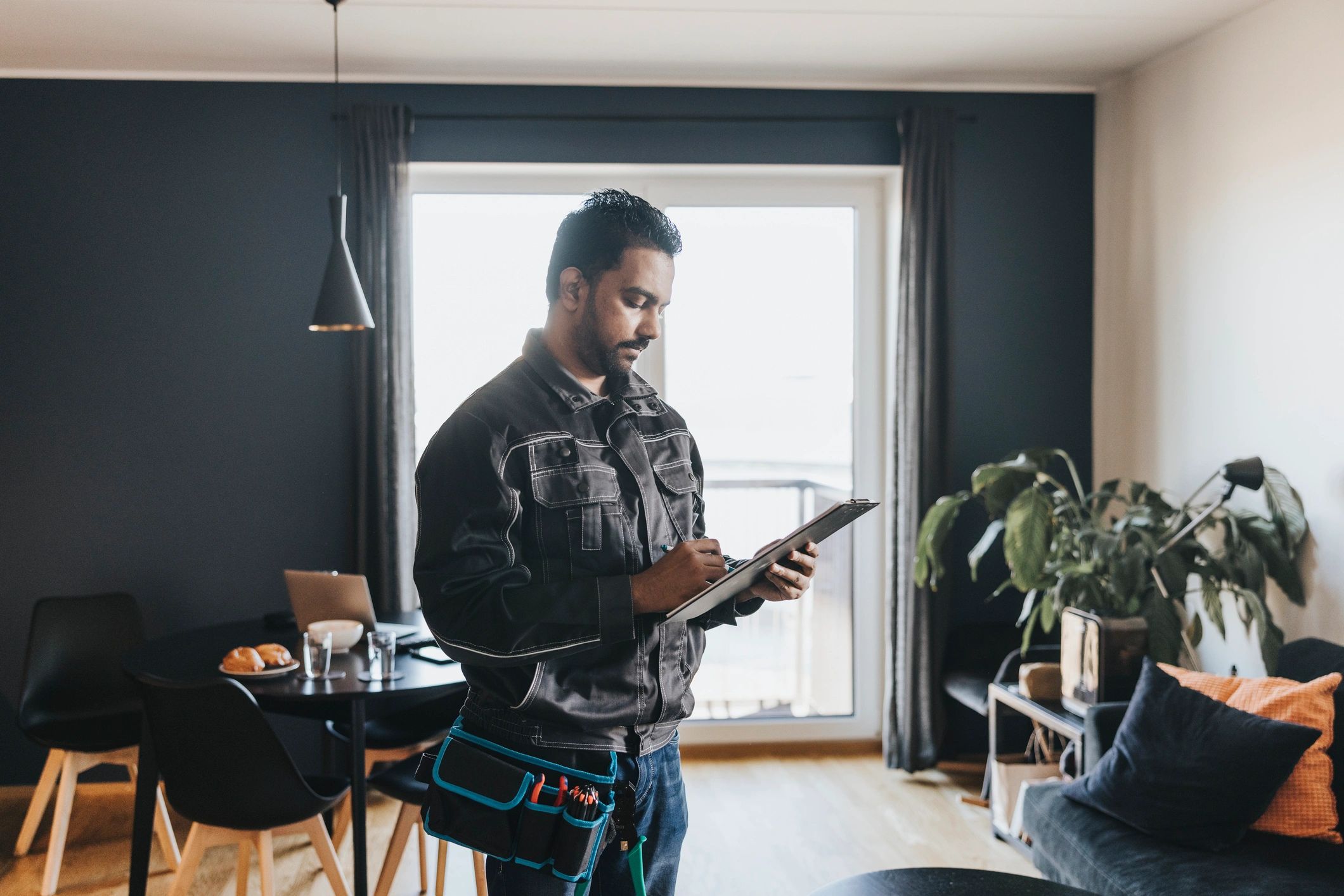 Technician documenting work during a home visit