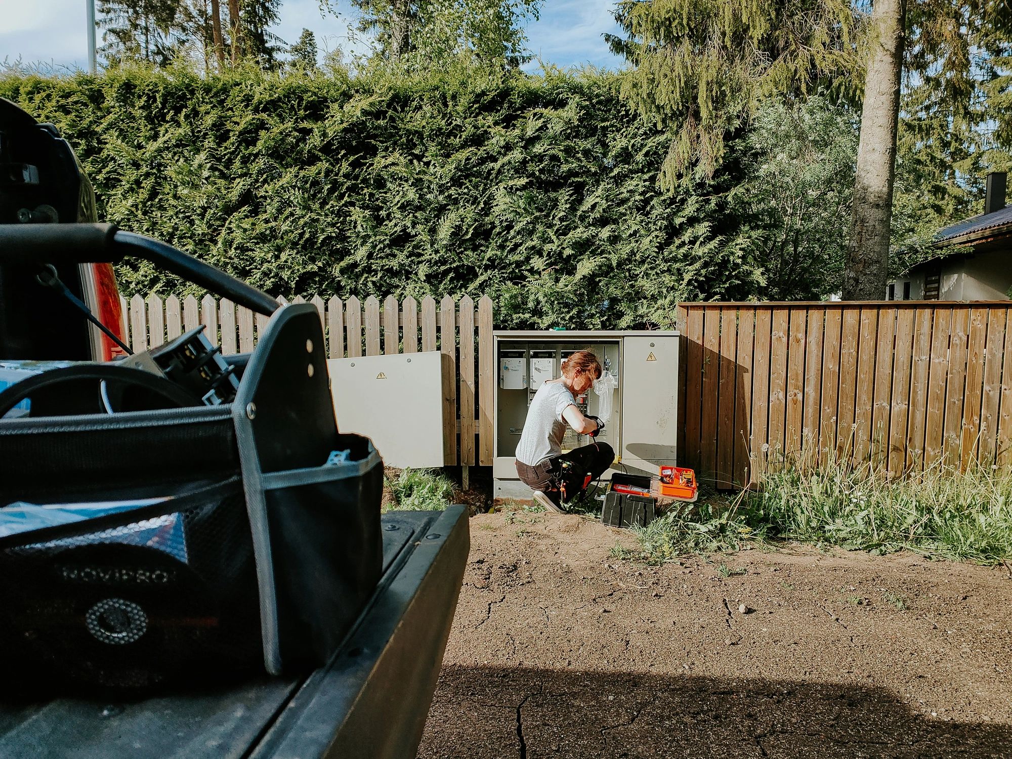 Technician working outdoors on HVAC equipment