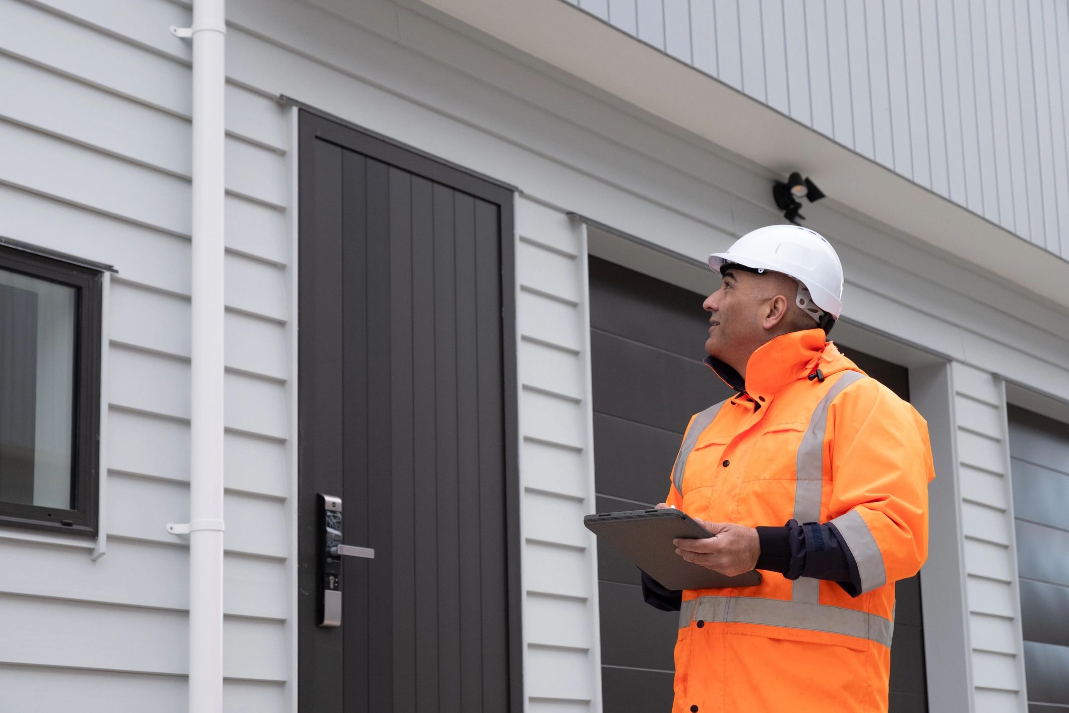 Inspector reviewing a home energy assessment checklist
