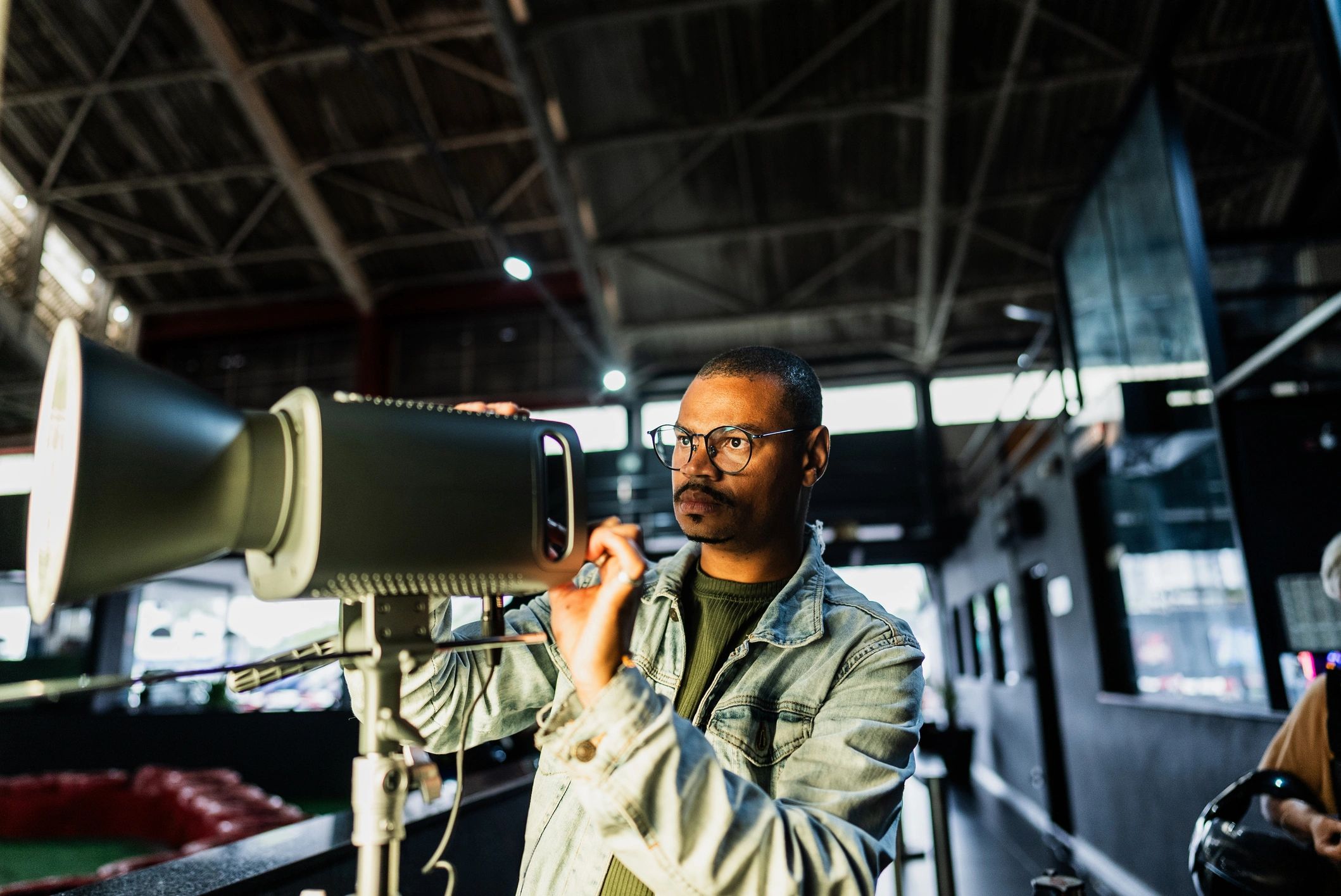 HVAC technician measuring ductwork for airflow balancing